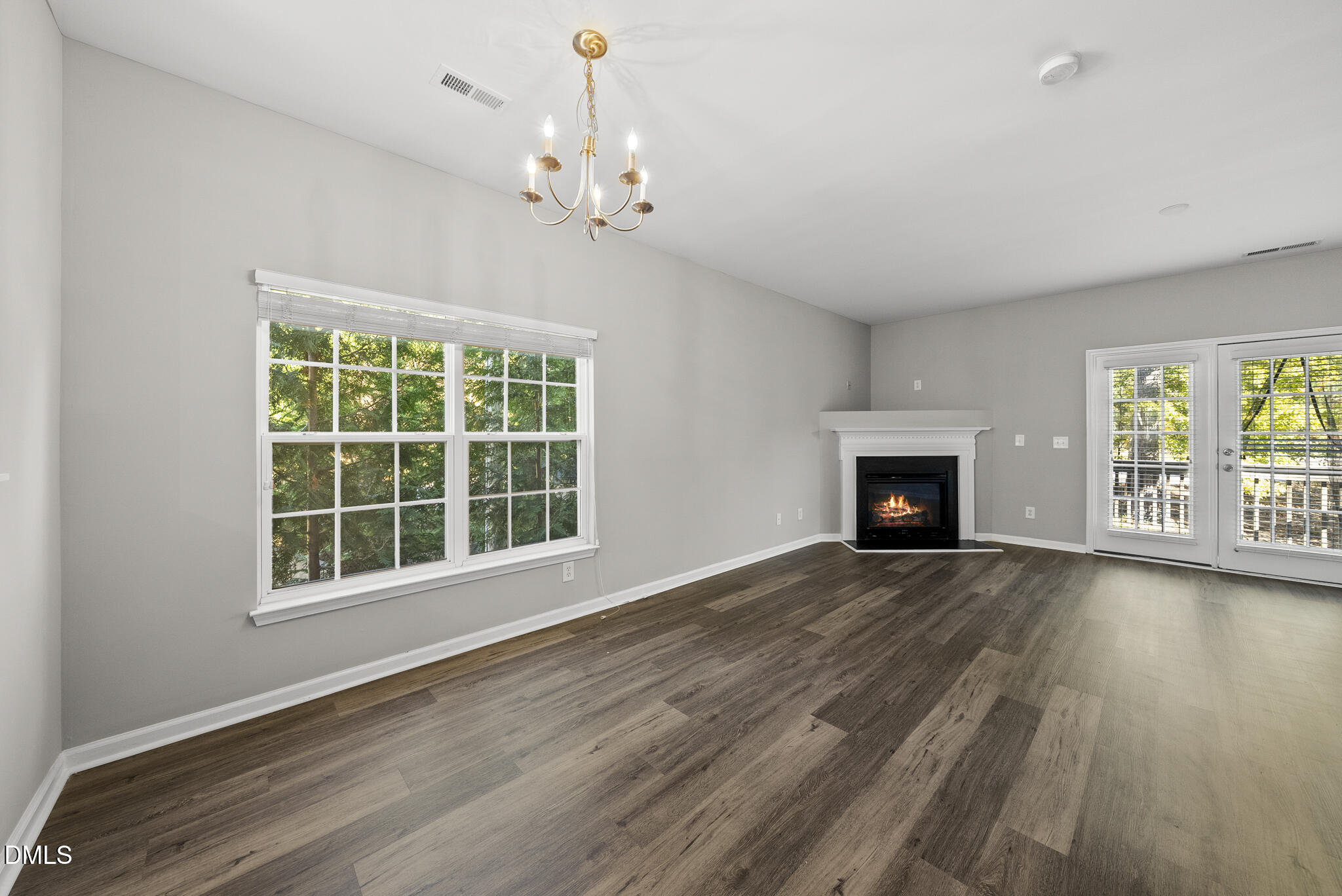 2615 Wyntercrest Lane Durham, NC 27713 - Photo 17 of 34 a view of an empty room with wooden floor and a window