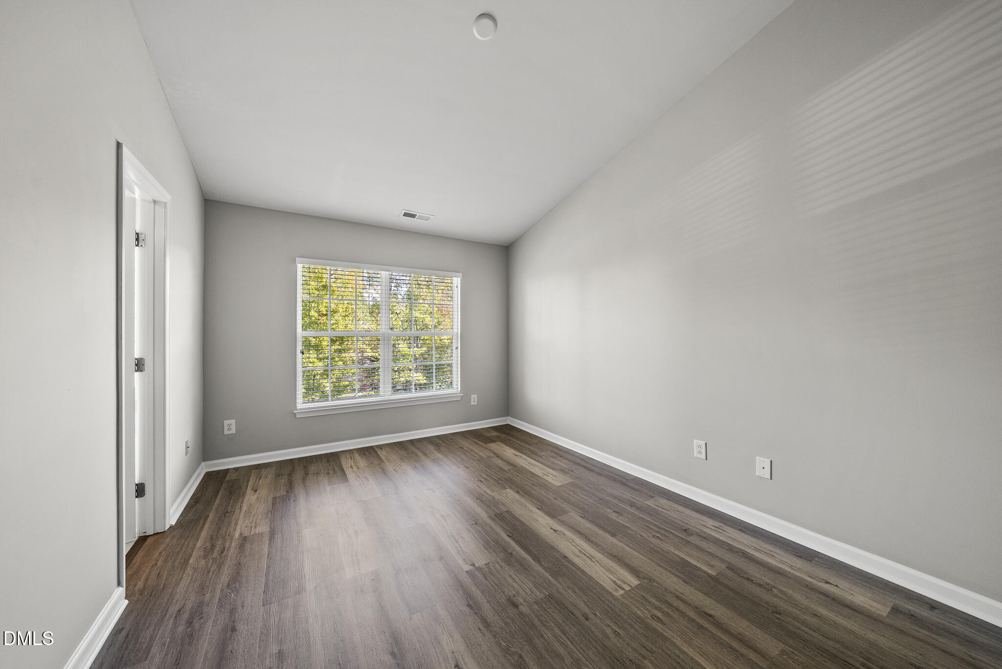 2615 Wyntercrest Lane Durham, NC 27713 - Photo 25 of 34 a view of room with window and hardwood floor