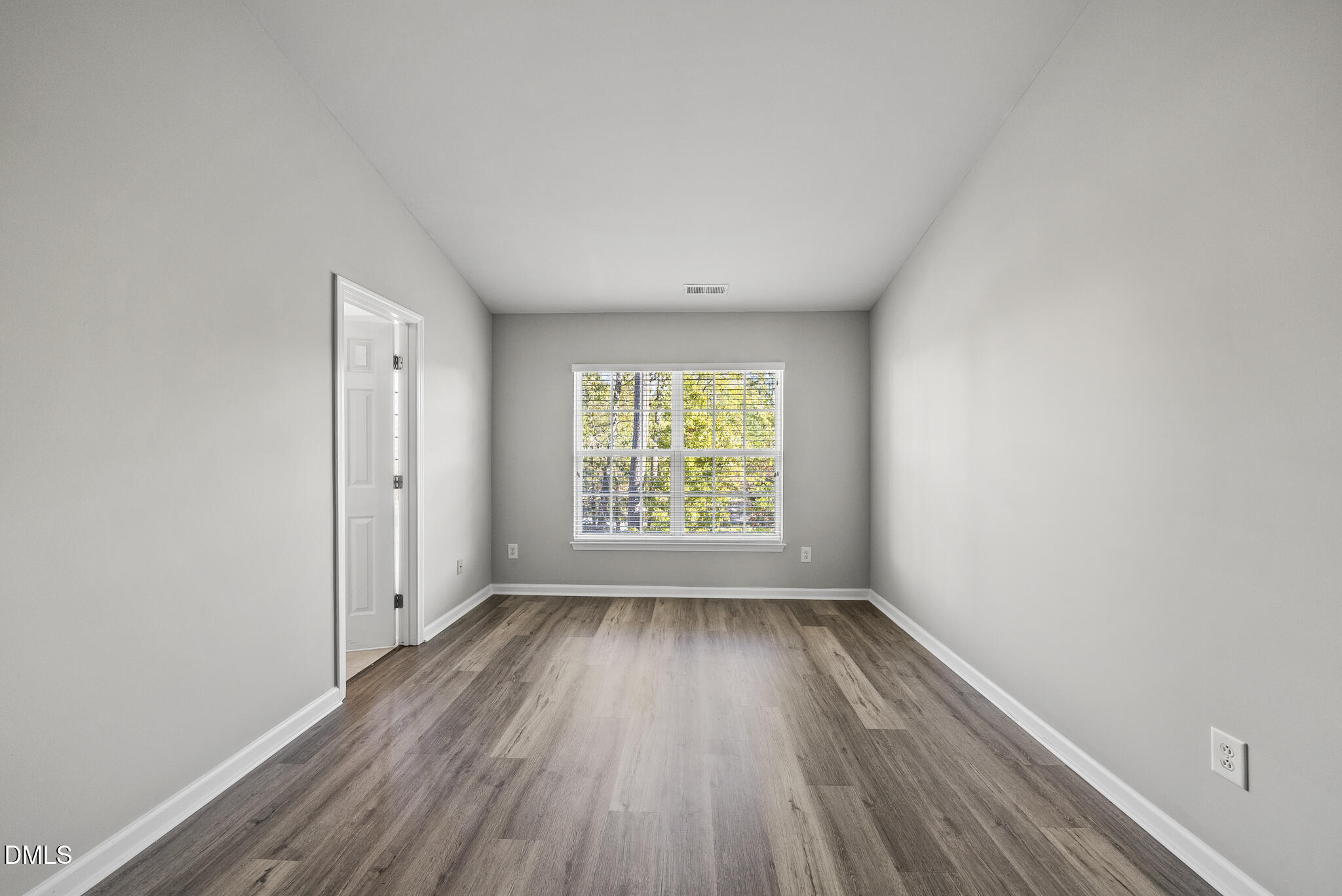 2615 Wyntercrest Lane Durham, NC 27713 - Photo 26 of 34 an empty room with wooden floor and windows