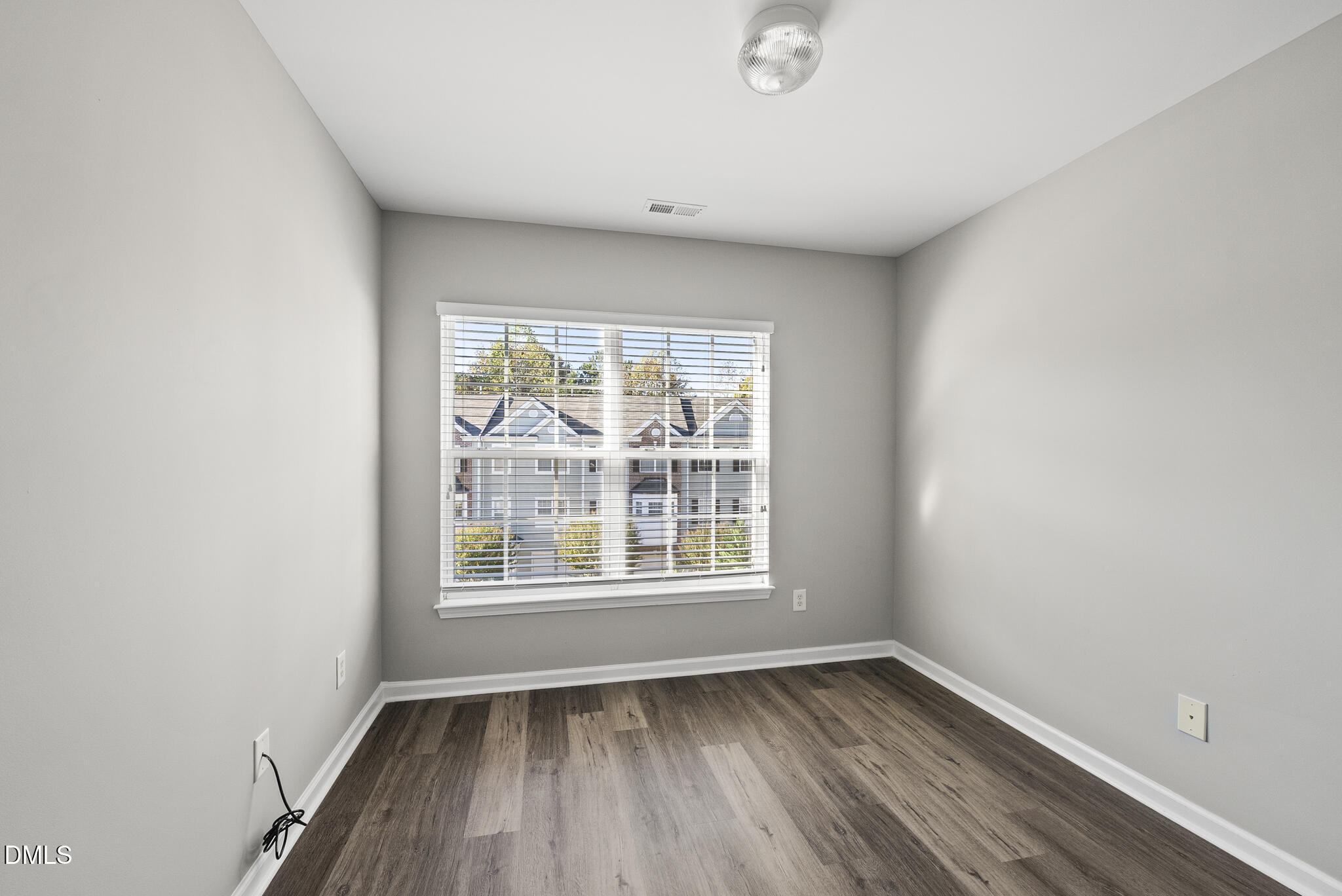 2615 Wyntercrest Lane Durham, NC 27713 - Photo 30 of 34 an empty room with wooden floor and windows
