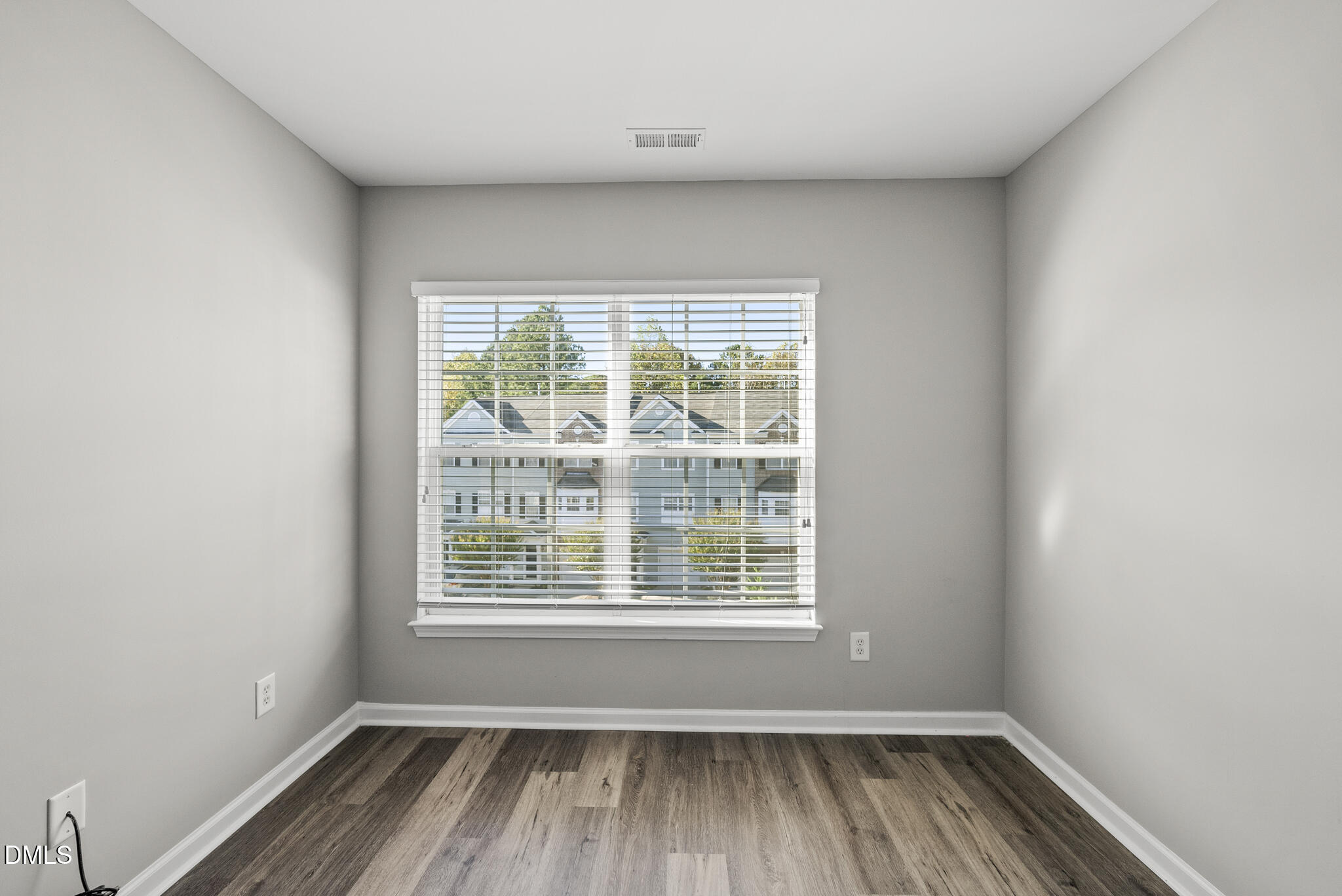 2615 Wyntercrest Lane Durham, NC 27713 - Photo 31 of 34 an empty room with wooden floor and windows