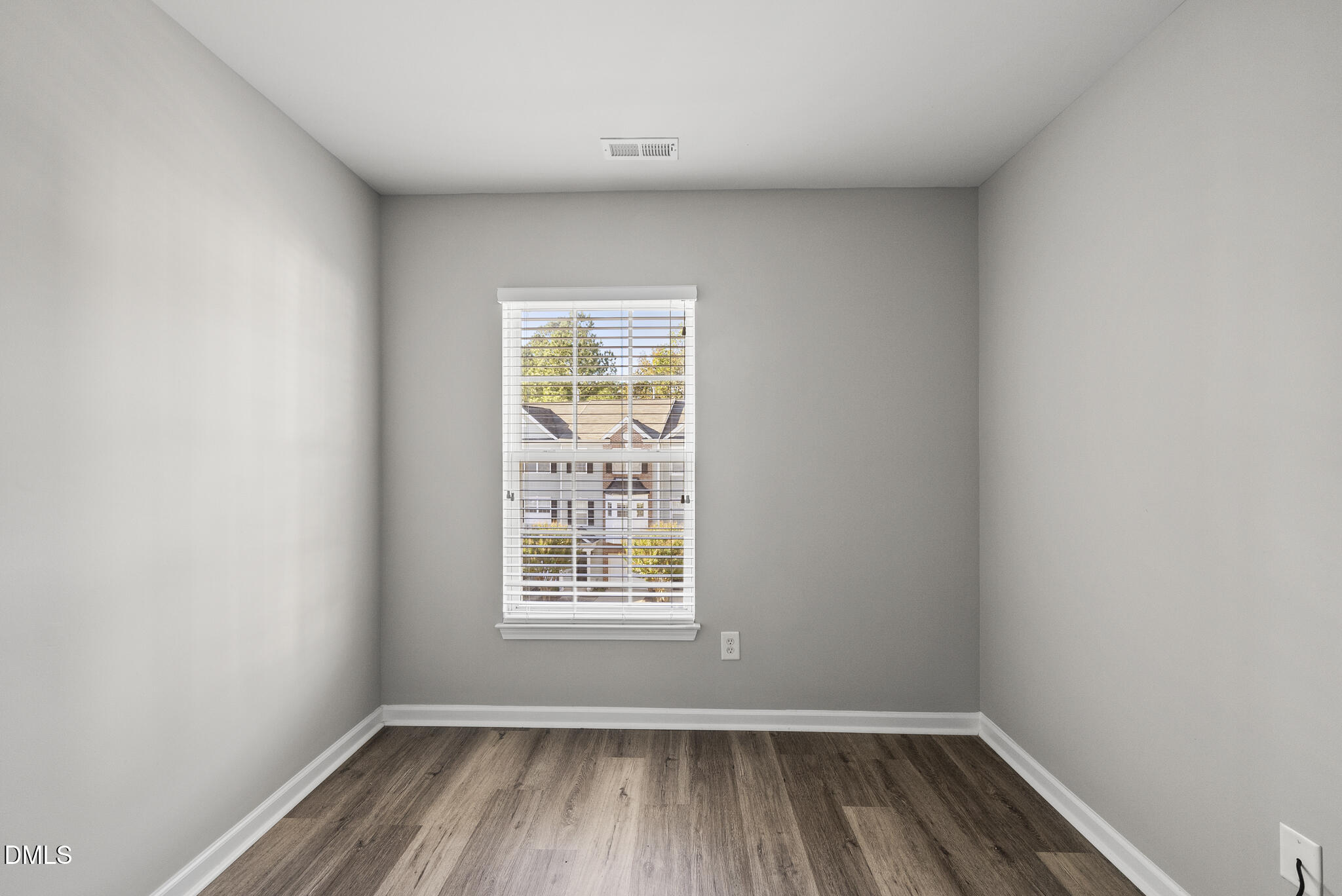 2615 Wyntercrest Lane Durham, NC 27713 - Photo 33 of 34 an empty room with wooden floor and windows