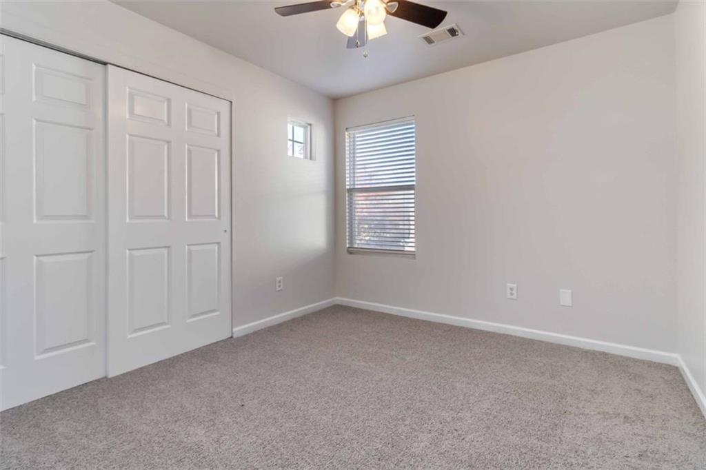 6265 Smoke Ridge Lane Cumming, GA 30041 - Photo 18 of 33 a view of an empty room with a window