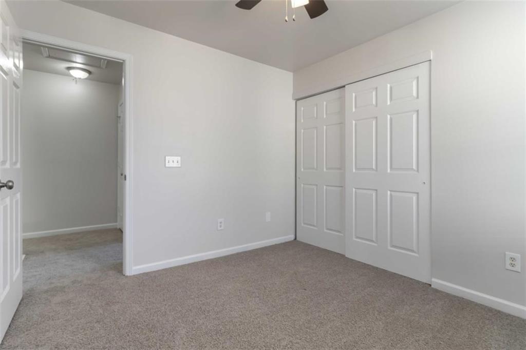 6265 Smoke Ridge Lane Cumming, GA 30041 - Photo 19 of 33 an empty room with closet area
