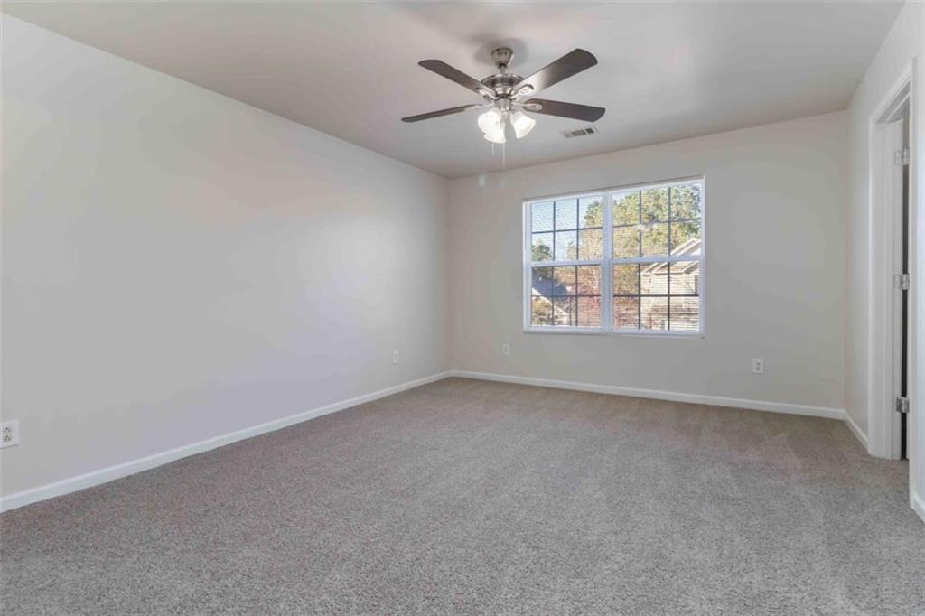 6265 Smoke Ridge Lane Cumming, GA 30041 - Photo 20 of 33 an empty room with a window