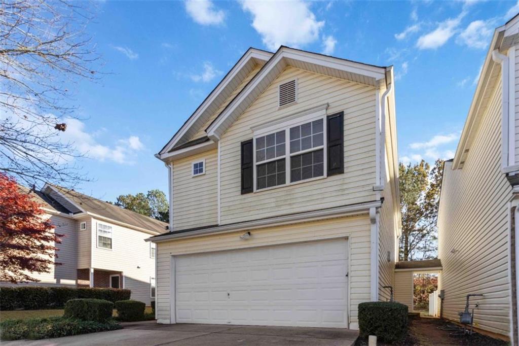 6265 Smoke Ridge Lane Cumming, GA 30041 - Photo 2 of 33 a front view of a house with a yard