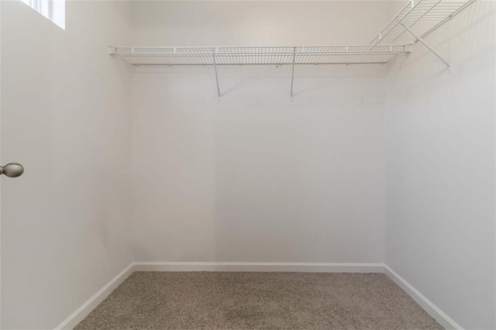 6265 Smoke Ridge Lane Cumming, GA 30041 - Photo 22 of 33 a room that has a window in it