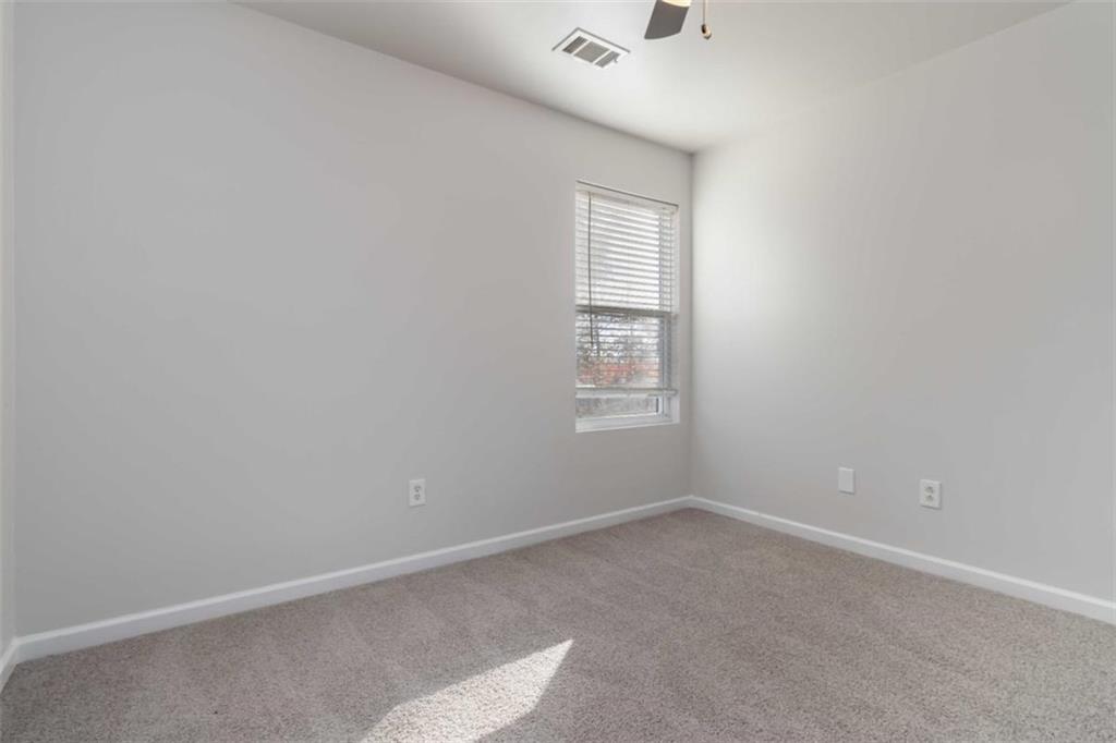 6265 Smoke Ridge Lane Cumming, GA 30041 - Photo 24 of 33 an empty room with windows