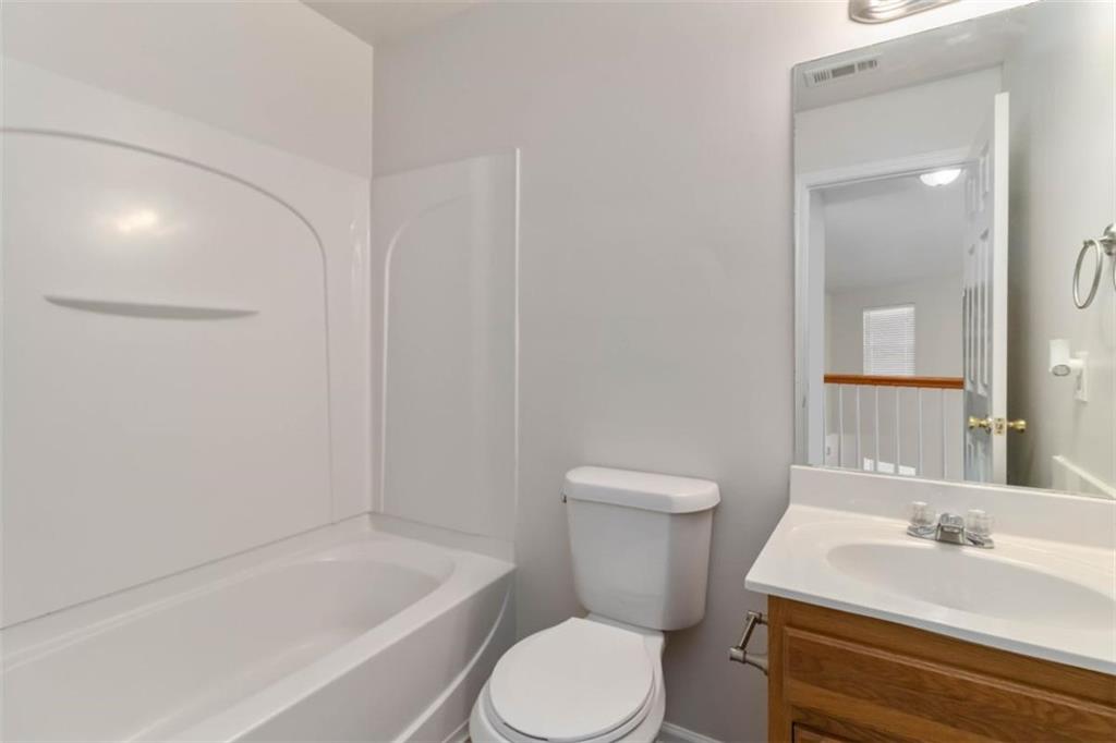 6265 Smoke Ridge Lane Cumming, GA 30041 - Photo 26 of 33 a bathroom with a sink toilet and shower