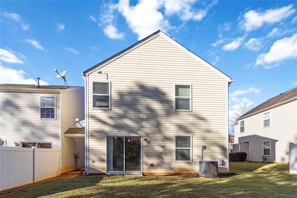 6265 Smoke Ridge Lane Cumming, GA 30041 - Photo 29 of 33 a view of a house with a yard