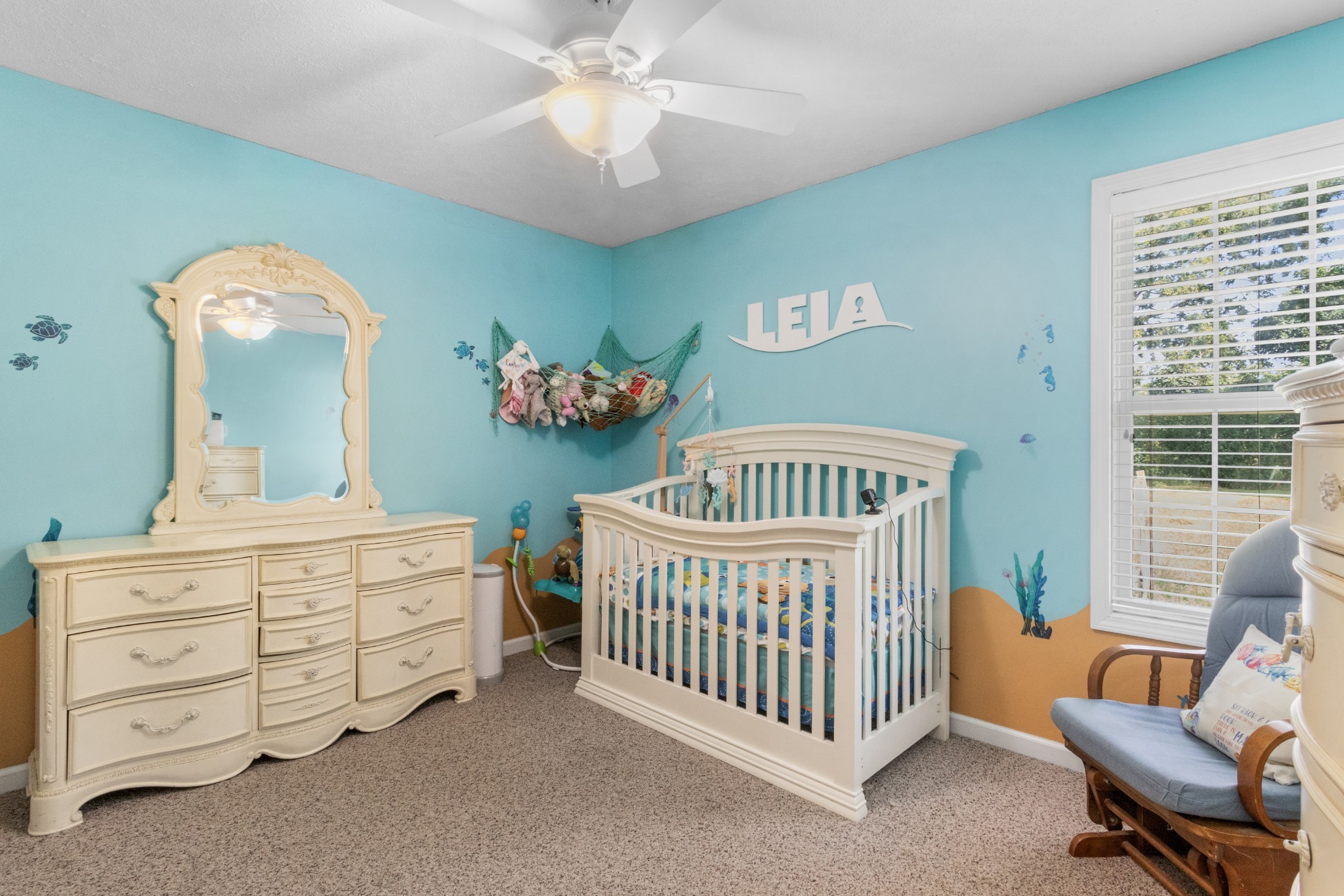 1033 Sivley Road Hopkinsville, KY 42240 - Photo 21 of 23 a bedroom with a bed and a chandelier