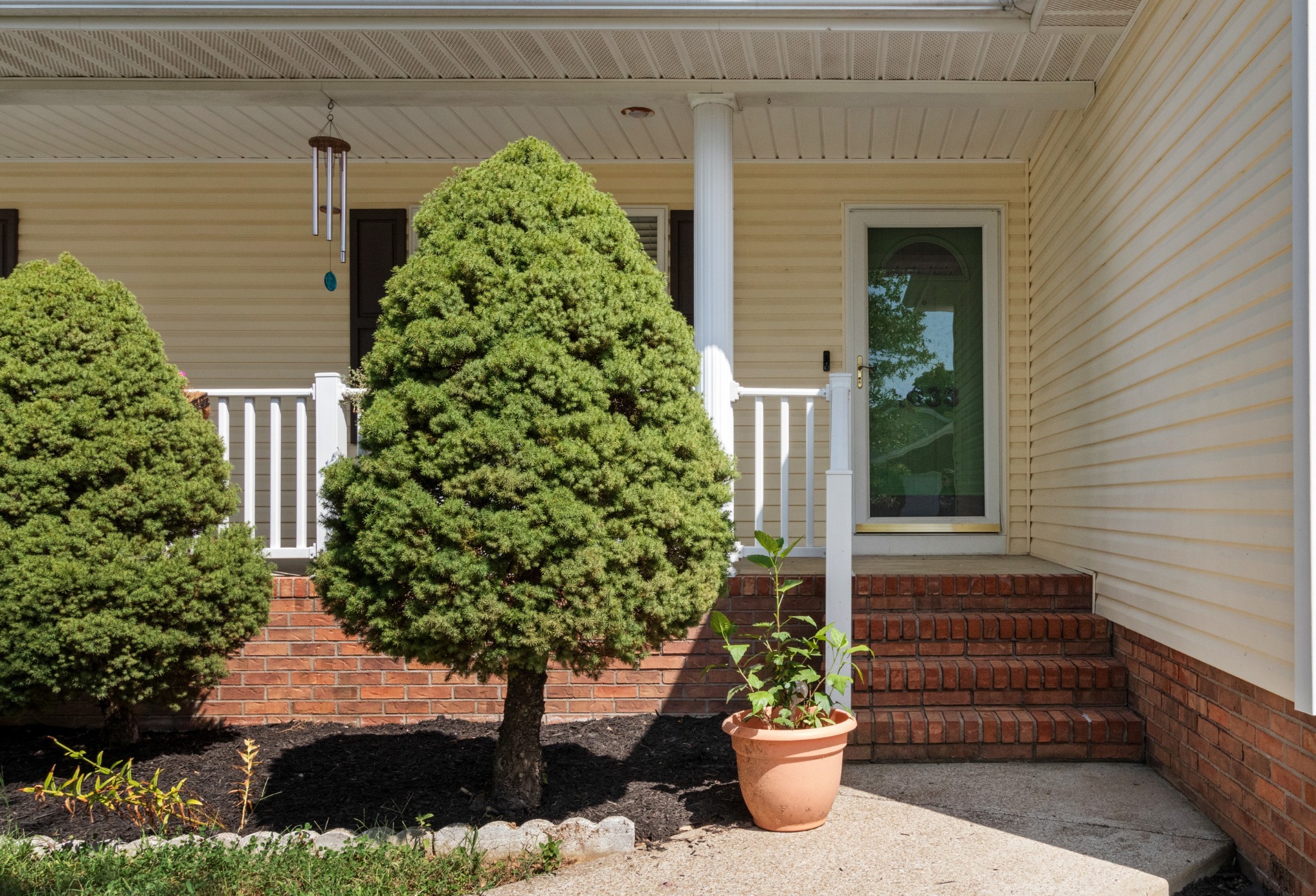 1033 Sivley Road Hopkinsville, KY 42240 - Photo 3 of 23 a front view of a house with a yard and potted plants