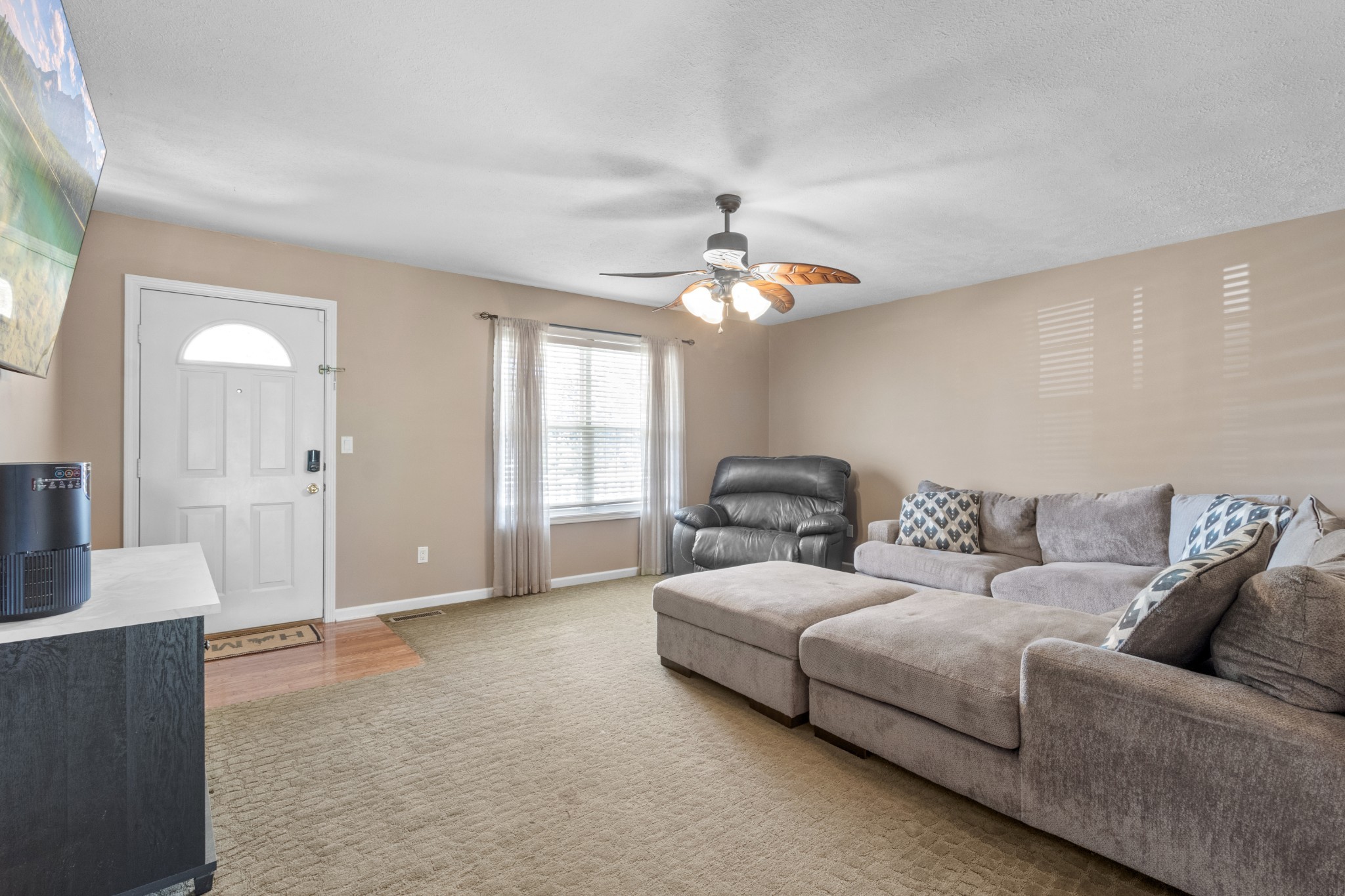 1033 Sivley Road Hopkinsville, KY 42240 - Photo 9 of 23 a living room with furniture and a chandelier