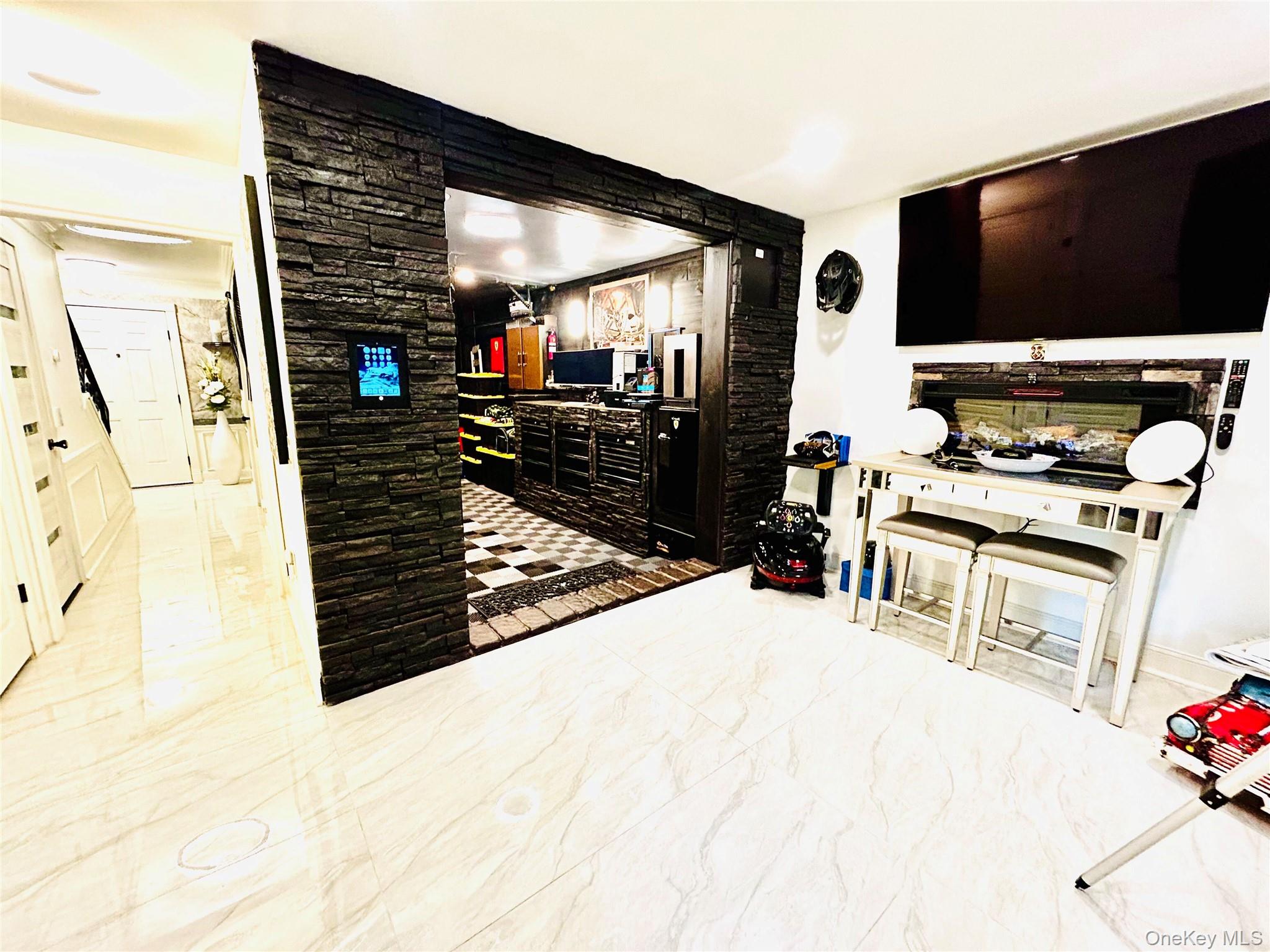 58 Rialto Way Patchogue, NY 11772 - Photo 33 of 40 a view of a living room with furniture and flat screen tv