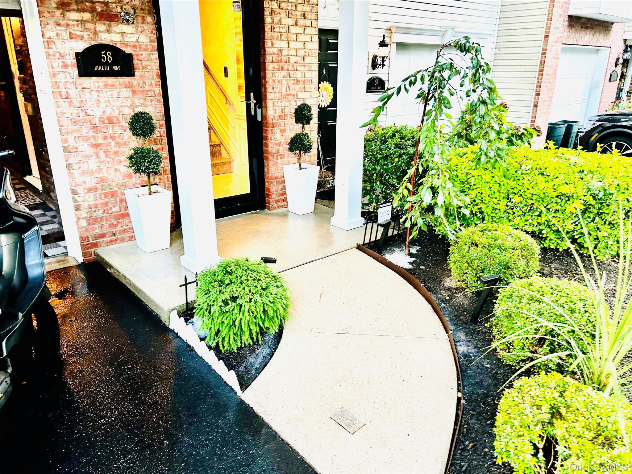 58 Rialto Way Patchogue, NY 11772 - Photo 4 of 40 a view of flower garden with wooden floor