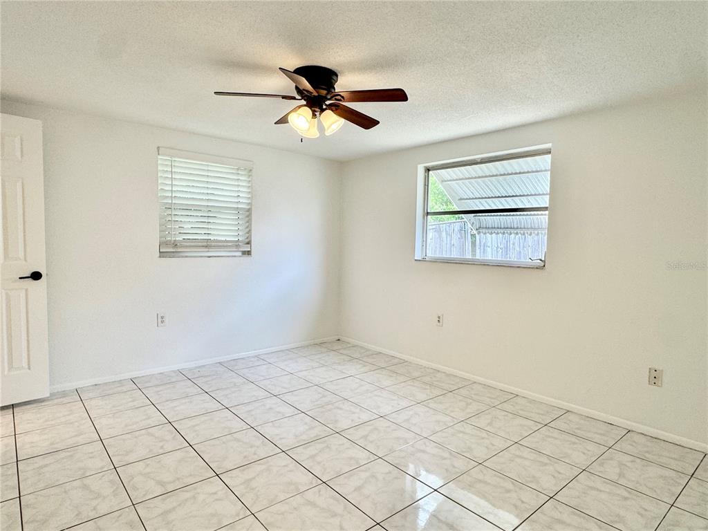 7235 Potomac Drive Port Richey, FL 34668 - Photo 13 of 23 a view of an empty room and window