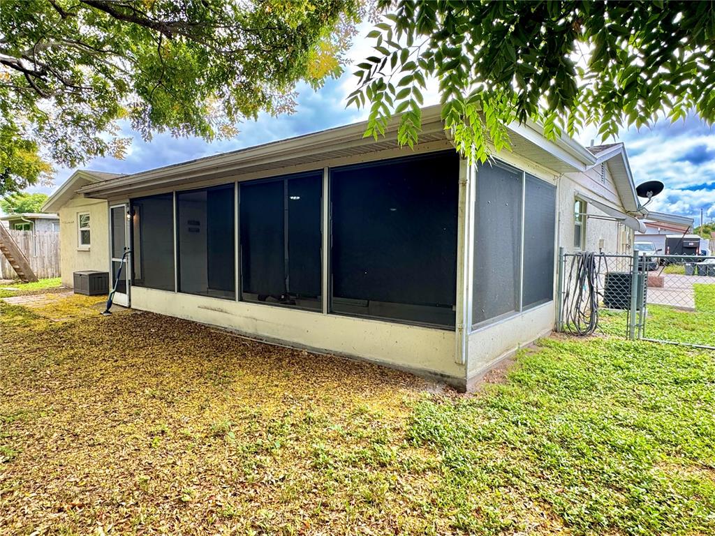 7235 Potomac Drive Port Richey, FL 34668 - Photo 19 of 23 a view of a house with a yard