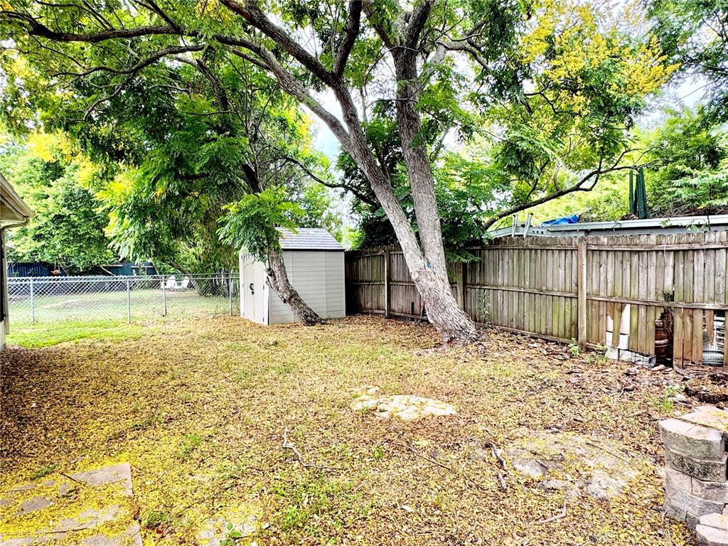 7235 Potomac Drive Port Richey, FL 34668 - Photo 20 of 23 a house with trees in front of it