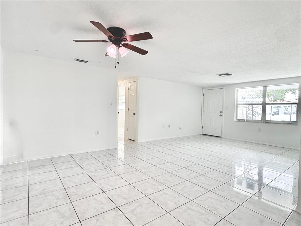 7235 Potomac Drive Port Richey, FL 34668 - Photo 3 of 23 a view of an empty room and window