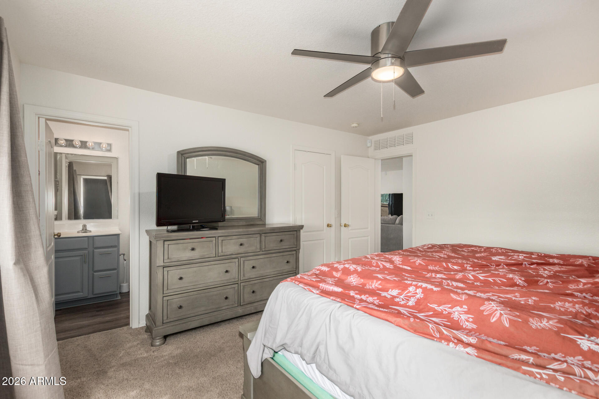 8806 South 9th Street Phoenix, AZ 85042 - Photo 14 of 31 a bedroom with a bed and a flat screen tv