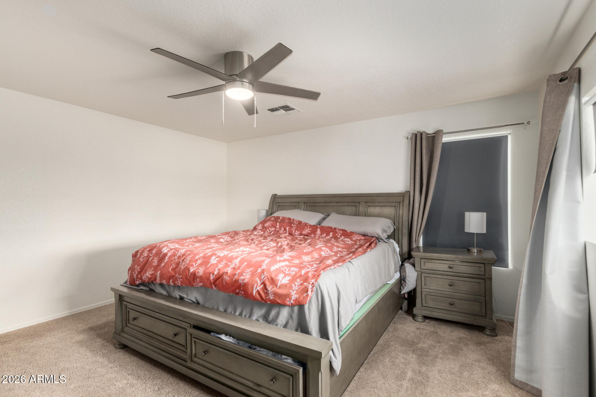 8806 South 9th Street Phoenix, AZ 85042 - Photo 15 of 31 a bedroom with a bed and a ceiling fan