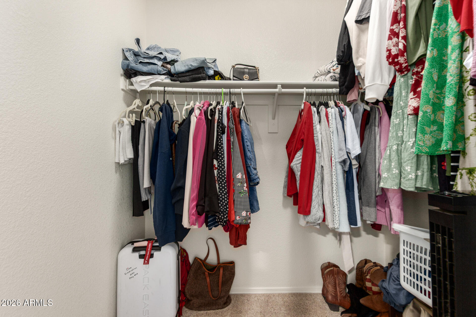 8806 South 9th Street Phoenix, AZ 85042 - Photo 17 of 31 a view of walk in closet with clothes and shoes