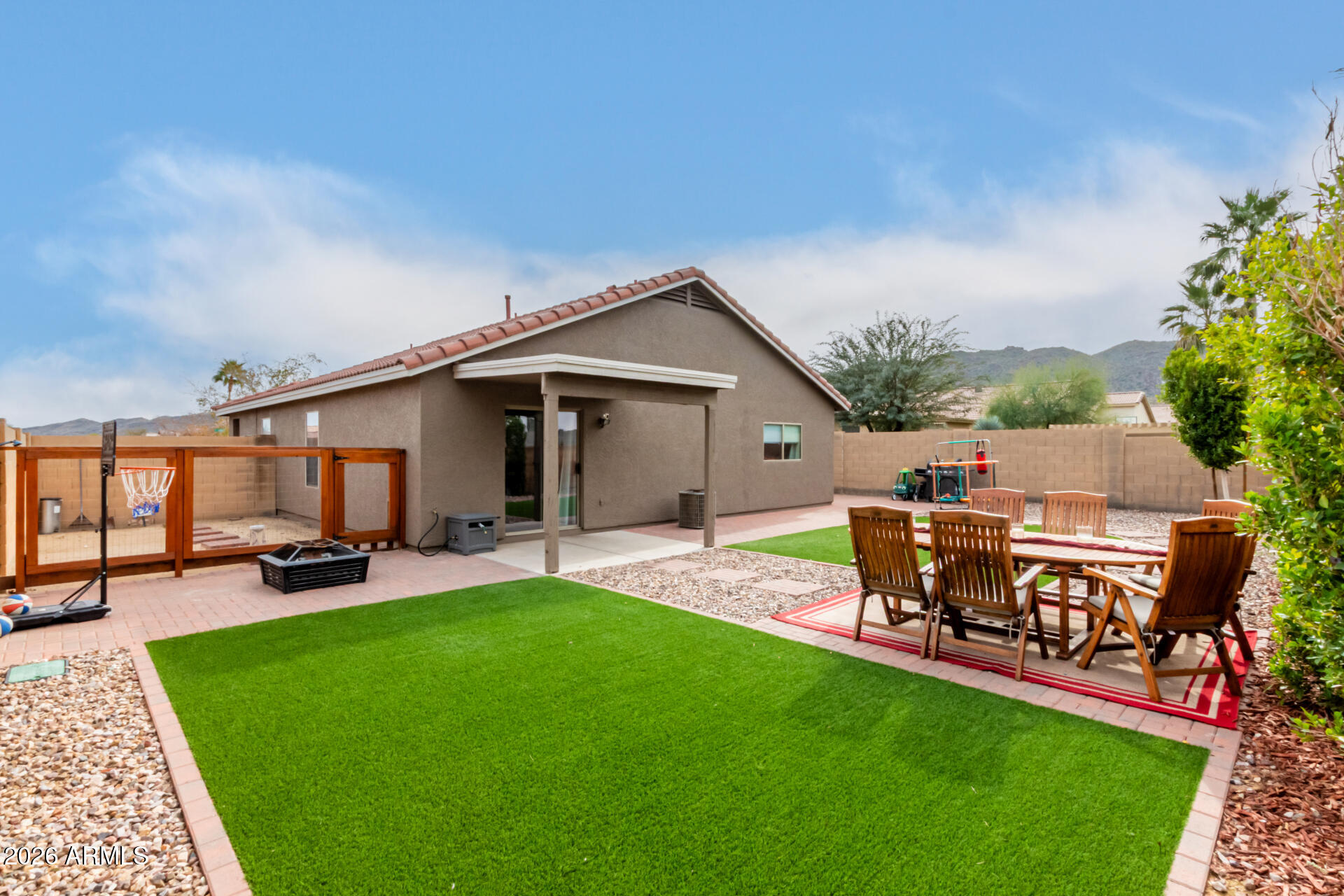 8806 South 9th Street Phoenix, AZ 85042 - Photo 28 of 31 a view of a patio with table and chairs floor to ceiling window