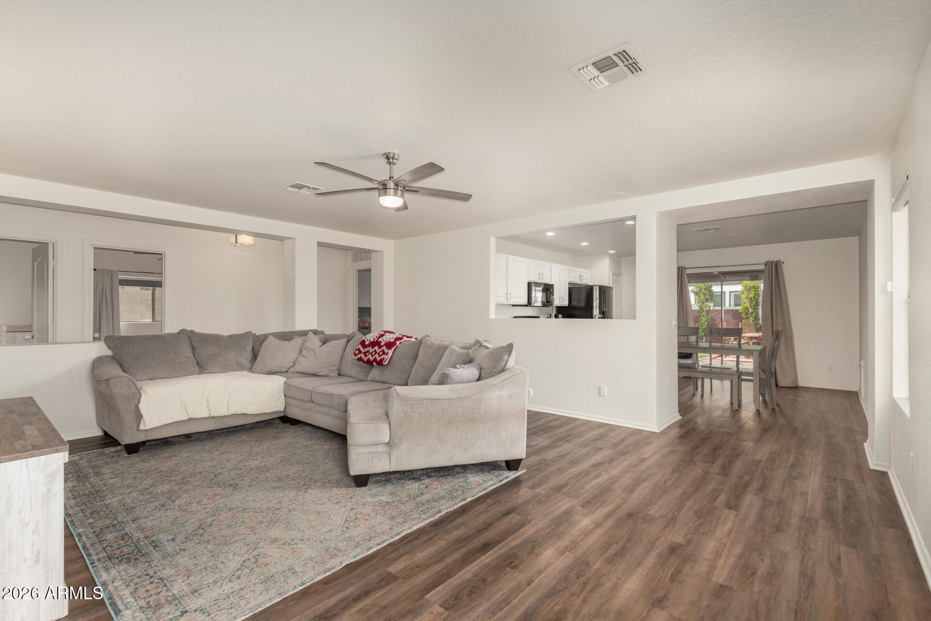 8806 South 9th Street Phoenix, AZ 85042 - Photo 5 of 31 a living room with furniture and wooden floor
