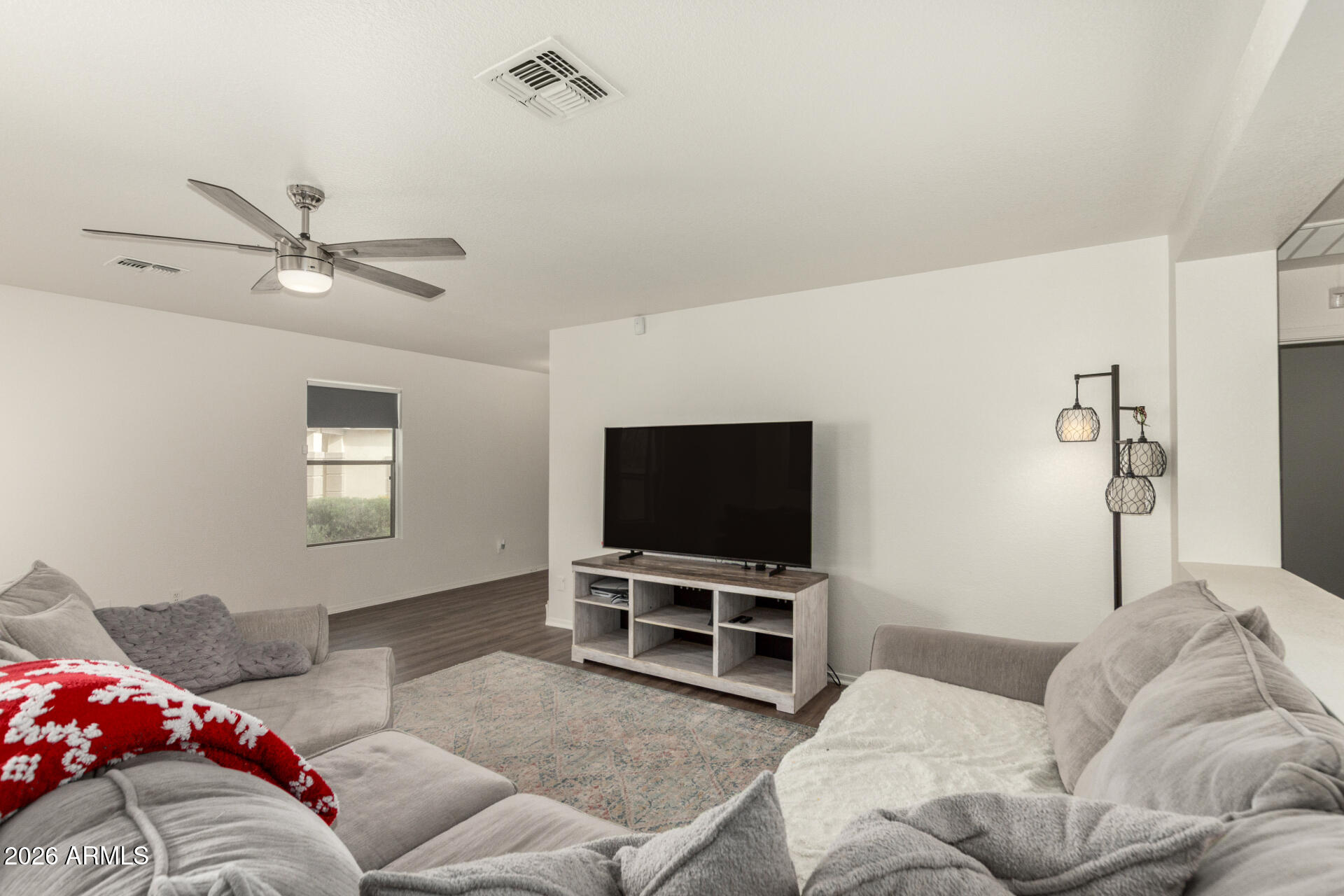 8806 South 9th Street Phoenix, AZ 85042 - Photo 6 of 31 a living room with furniture and a flat screen tv