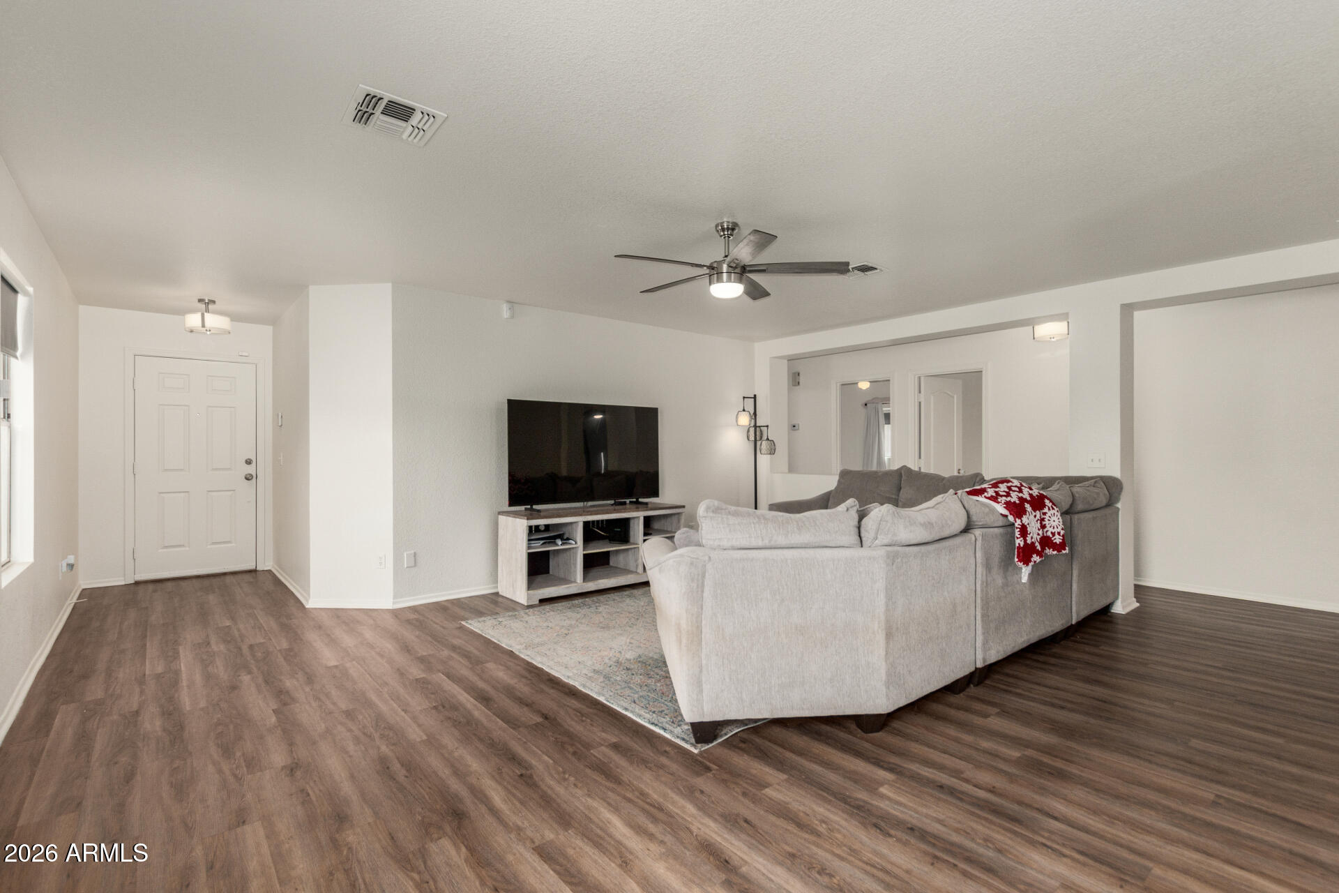 8806 South 9th Street Phoenix, AZ 85042 - Photo 7 of 31 a living room with furniture and a flat screen tv
