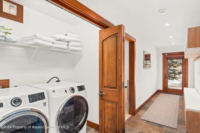 a view of a backyard with wooden fence