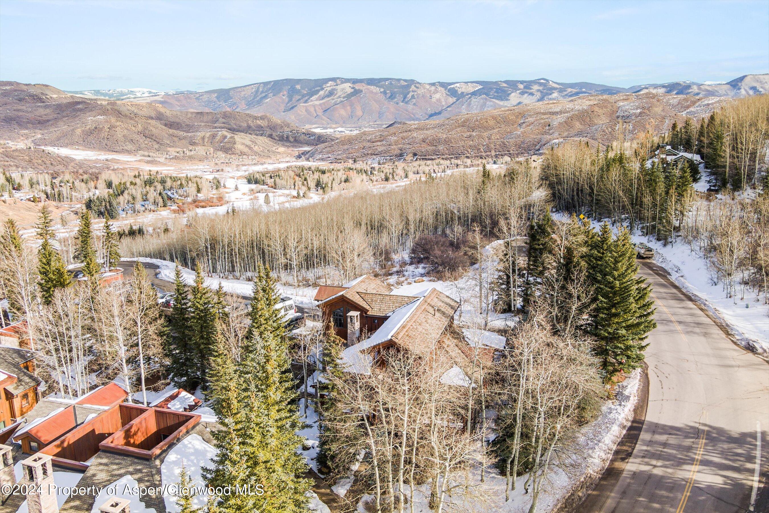 227 Faraway Road, Unit 38 Snowmass Village, CO 81615 - Photo 50 of 71 a view of a city with mountains in the background