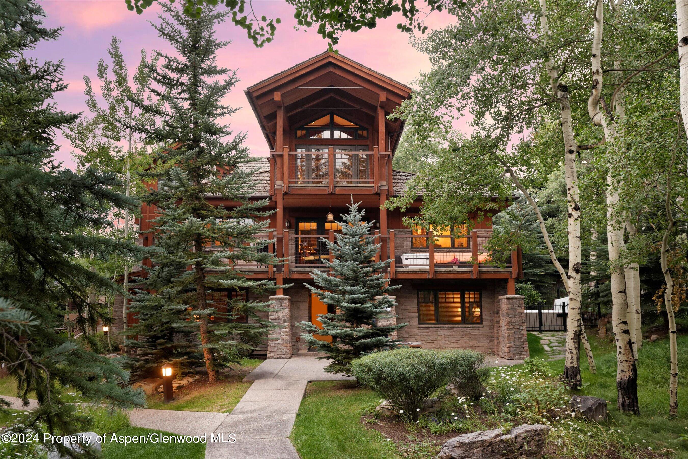 227 Faraway Road, Unit 38 Snowmass Village, CO 81615 - Photo 54 of 71 a front view of a house with a garden