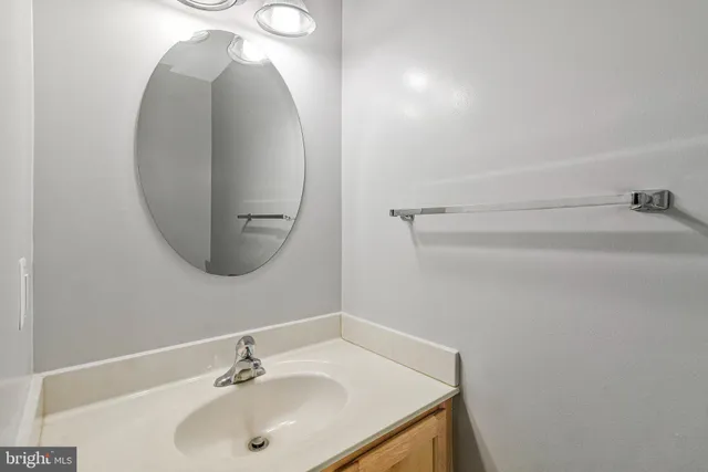 a bathroom with a sink and mirror