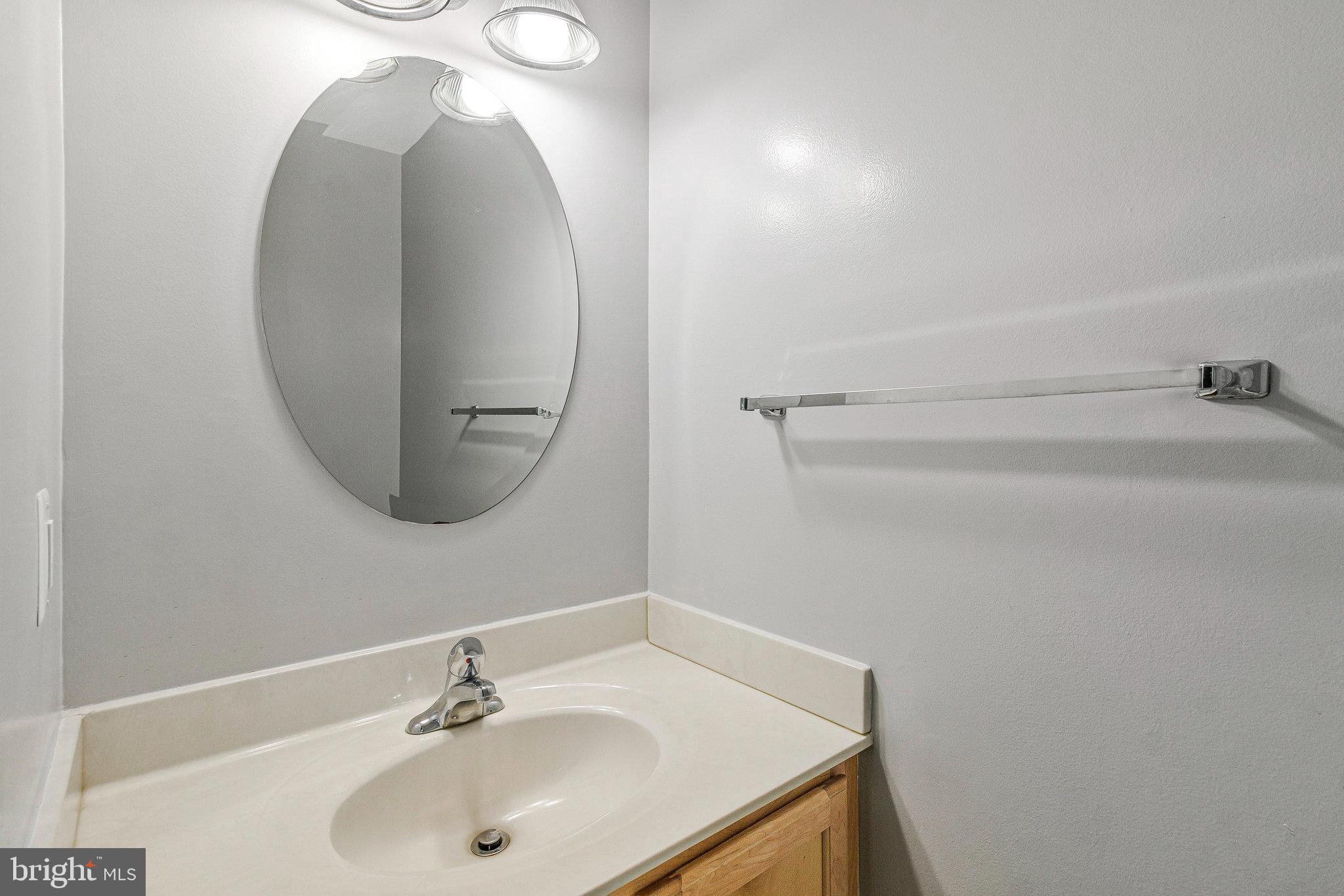 8020 Sleepy View Lane Springfield, VA 22153 - Photo 18 of 53 a bathroom with a sink and a mirror