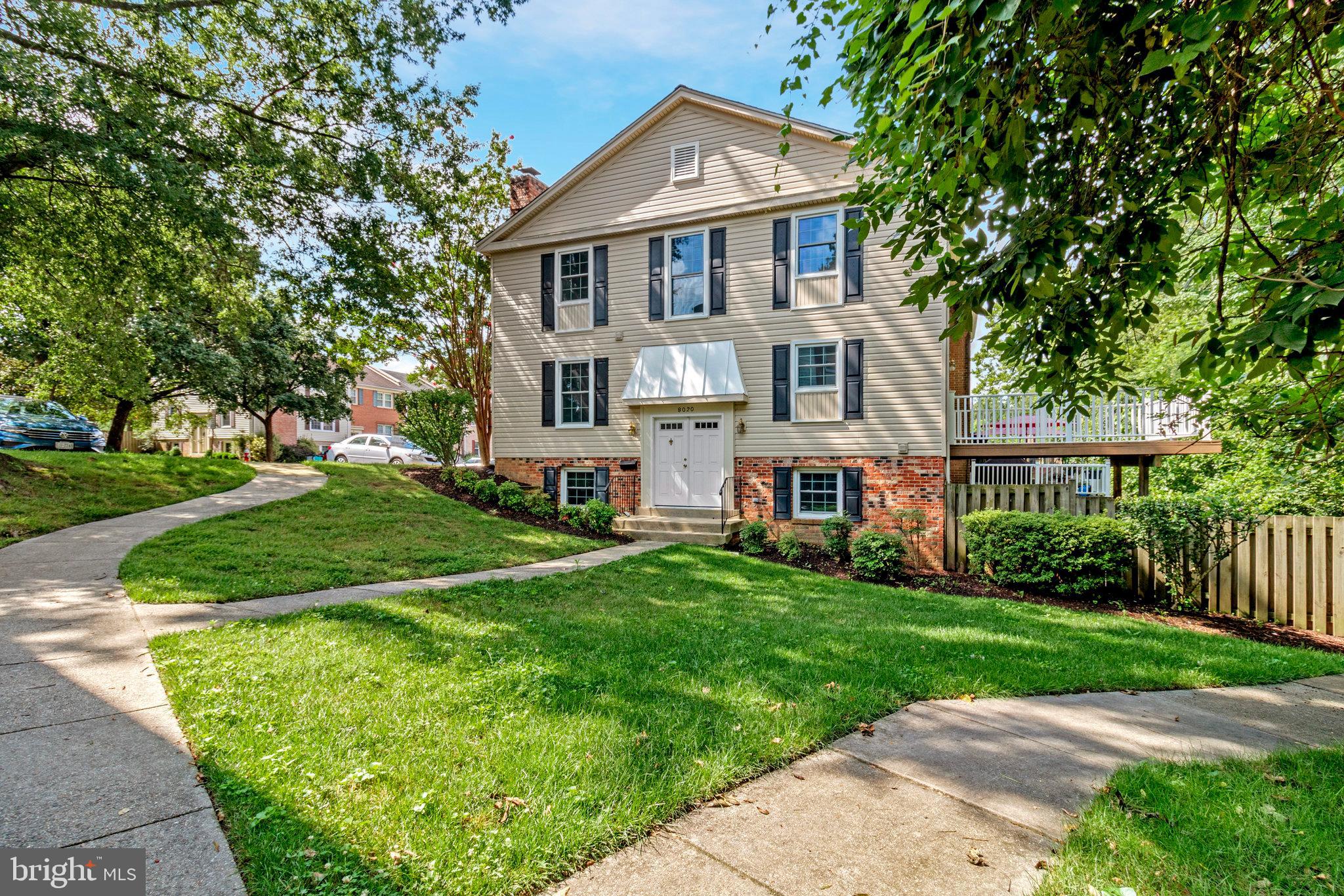 8020 Sleepy View Lane Springfield, VA 22153 - Photo 2 of 53 a front view of a house with a yard