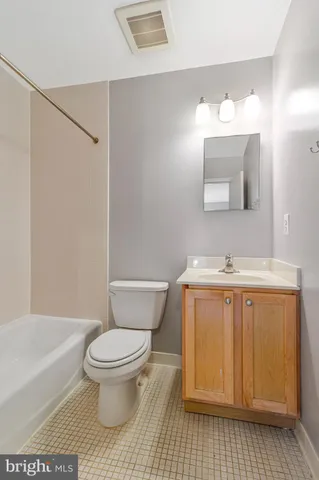 a view of an empty room and wooden floor