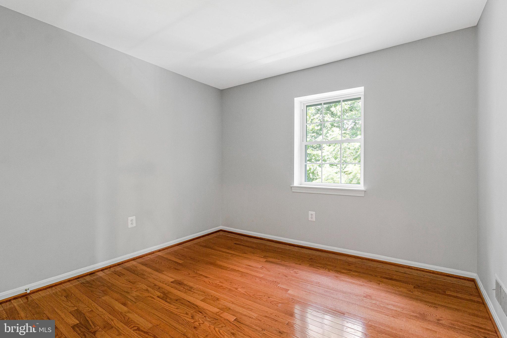8020 Sleepy View Lane Springfield, VA 22153 - Photo 24 of 53 a view of empty room with wooden floor