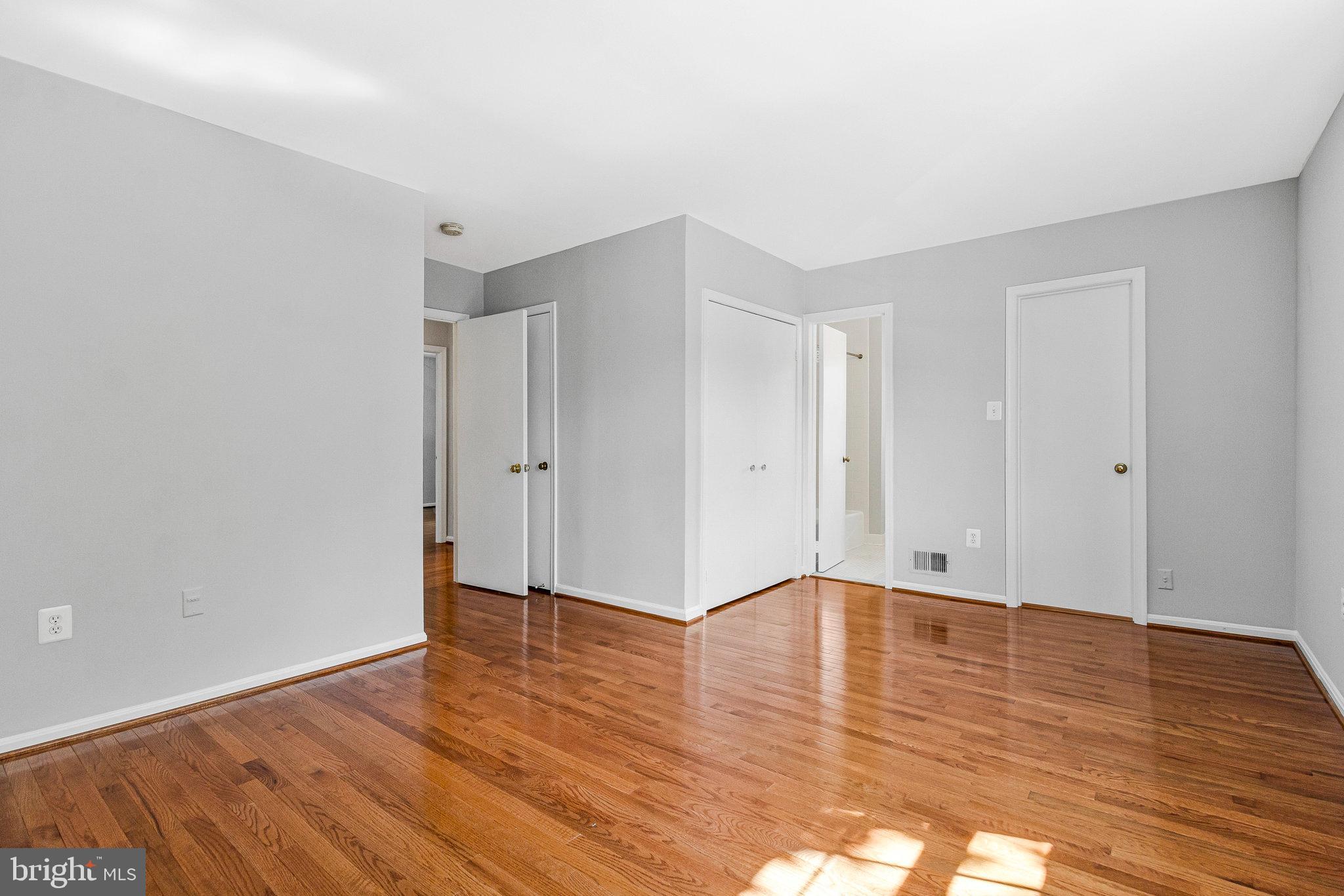 8020 Sleepy View Lane Springfield, VA 22153 - Photo 30 of 53 a view of an empty room with wooden floor