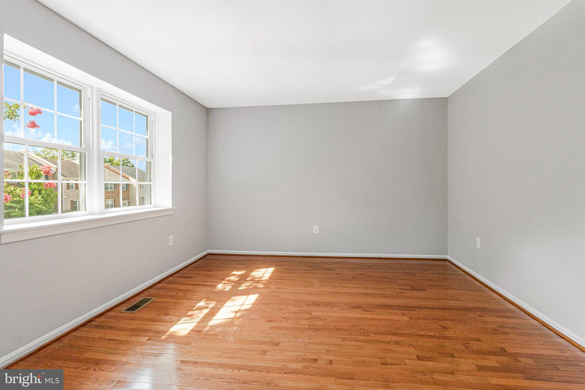 8020 Sleepy View Lane Springfield, VA 22153 - Photo 36 of 53 a view of empty room with wooden floor and fan