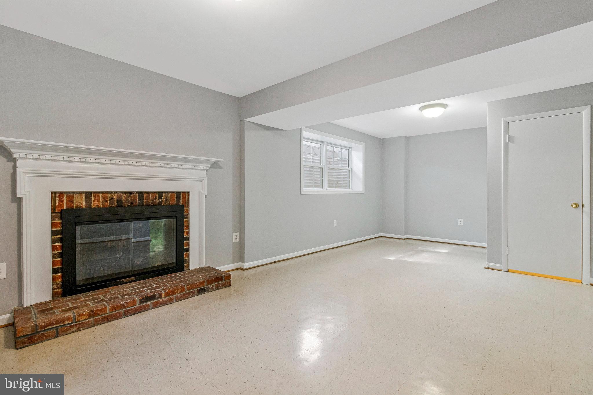 8020 Sleepy View Lane Springfield, VA 22153 - Photo 47 of 53 a view of an empty room with a fireplace