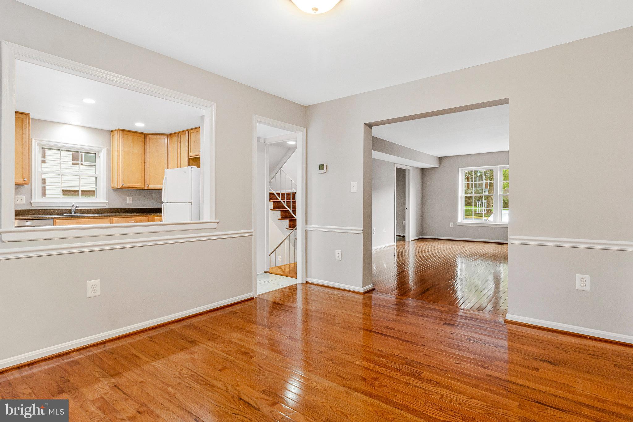 8020 Sleepy View Lane Springfield, VA 22153 - Photo 10 of 53 a view of a kitchen with wooden floor and electronic appliances