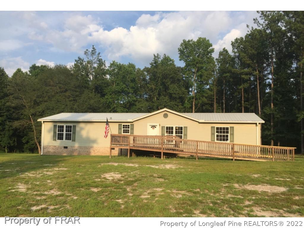 275 Deaton Road Raeford, NC 28376 - Photo 1 of 20 a view of a house with garden