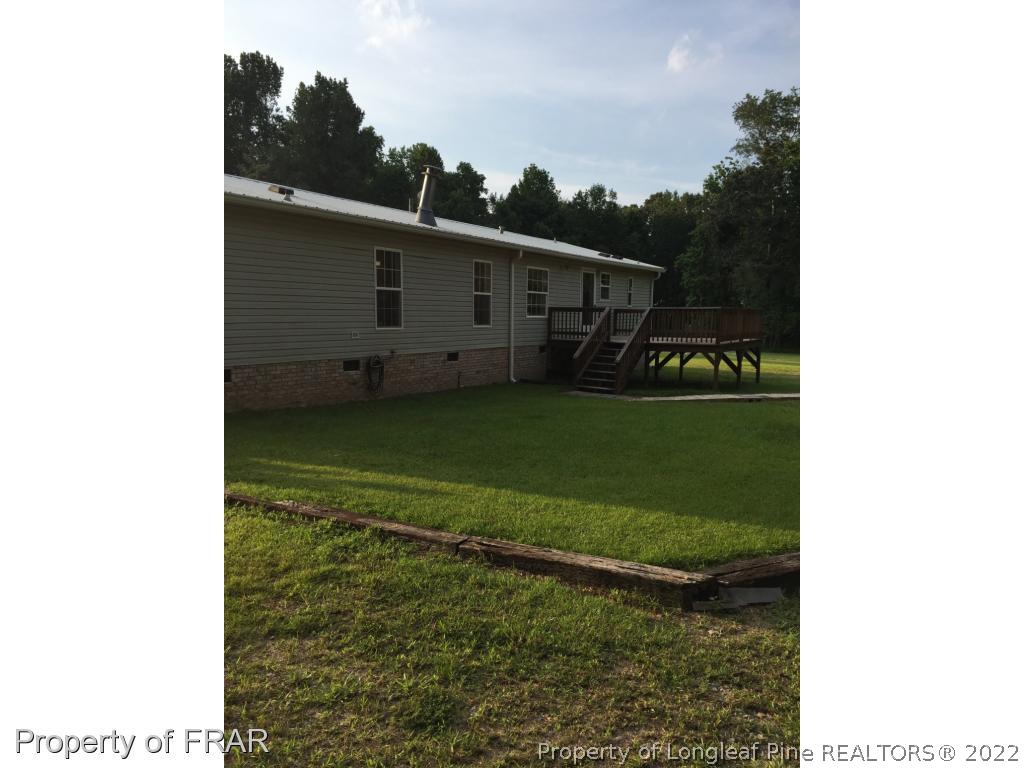 275 Deaton Road Raeford, NC 28376 - Photo 2 of 20 a view of a back yard of the house