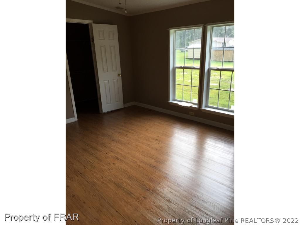 275 Deaton Road Raeford, NC 28376 - Photo 4 of 20 a view of a livingroom with wooden floor and a window
