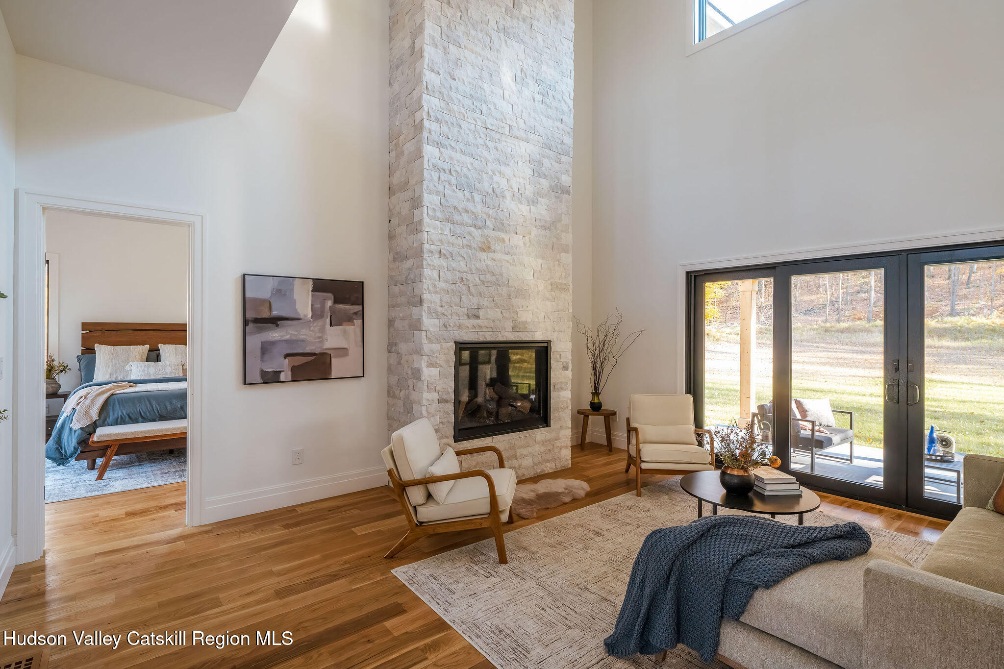 617 Harrington Drive Austerlitz, NY 12017 - Photo 15 of 32 a bedroom with furniture and a large window