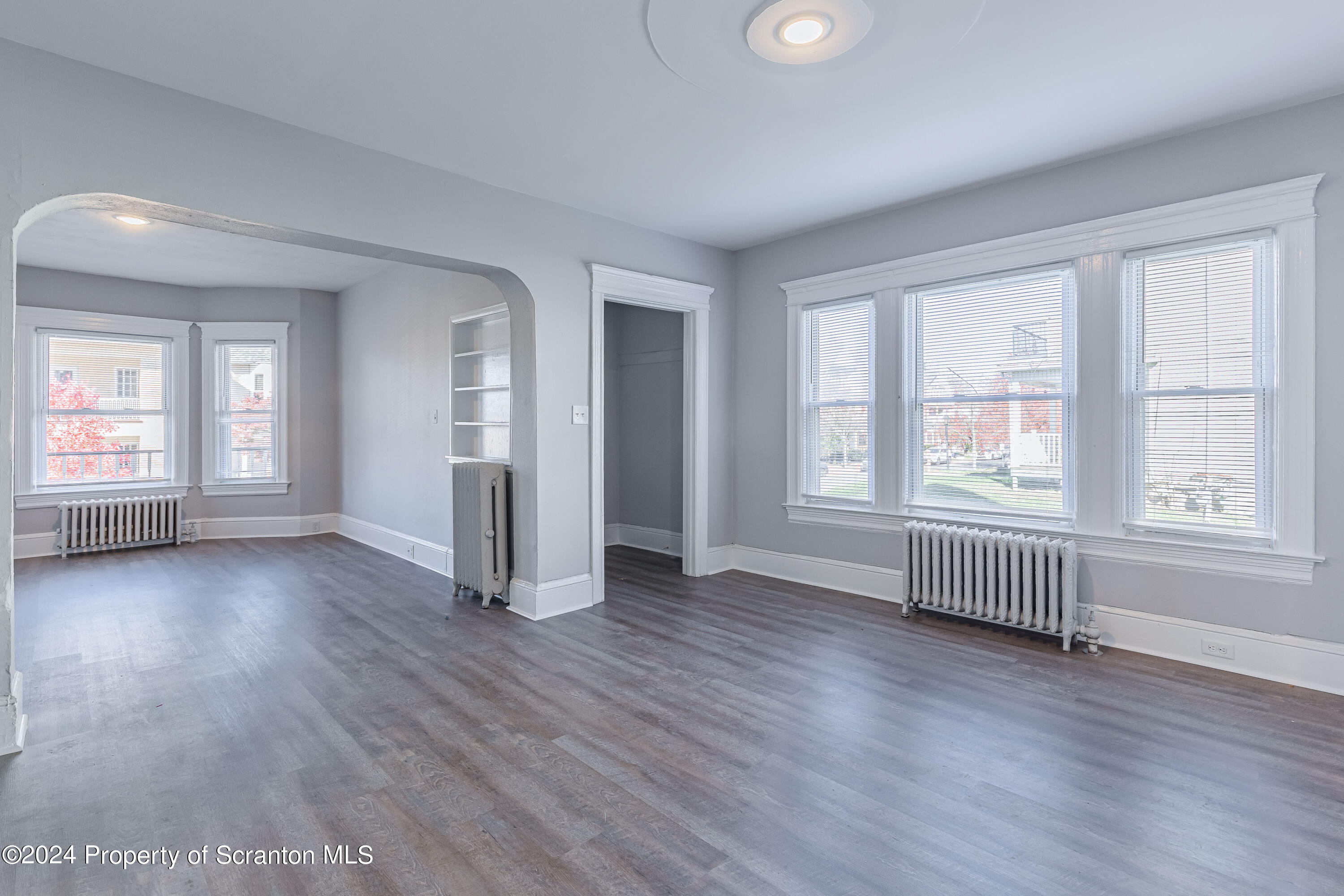 800 Quincy Avenue Scranton, PA 18510 - Photo 12 of 23 an empty room with wooden floor and windows