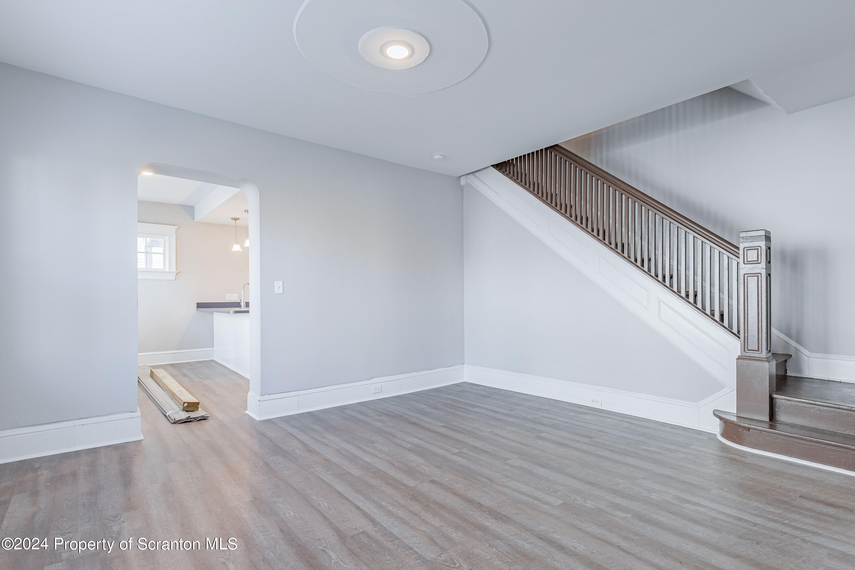 800 Quincy Avenue Scranton, PA 18510 - Photo 20 of 23 a view of an empty room with wooden floor and a window