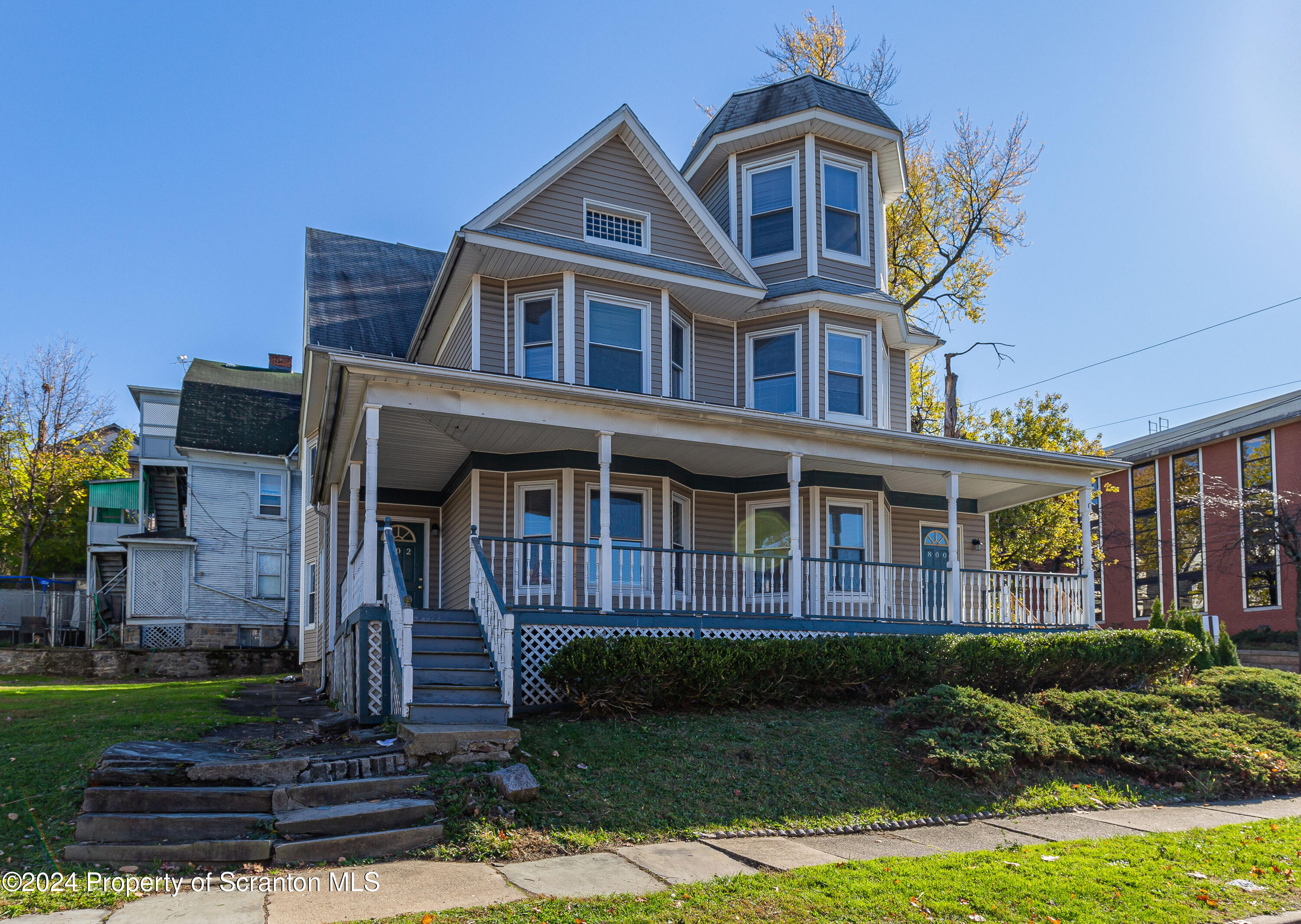 800 Quincy Avenue Scranton, PA 18510 - Photo 9 of 23 a front view of a house with a yard