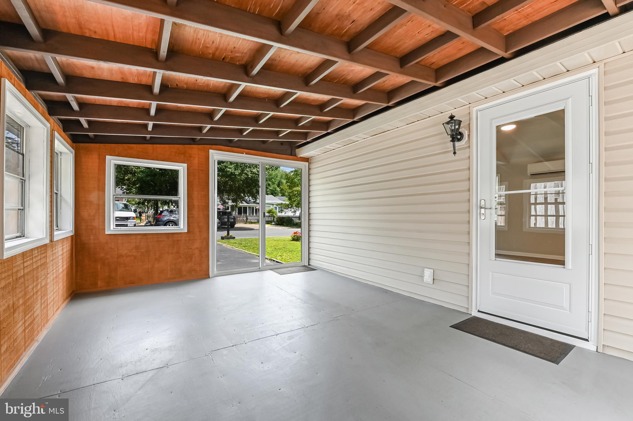 405 Bayview Drive Edgewater, MD 21037 - Photo 16 of 28 a view of an empty room with a fireplace and a window